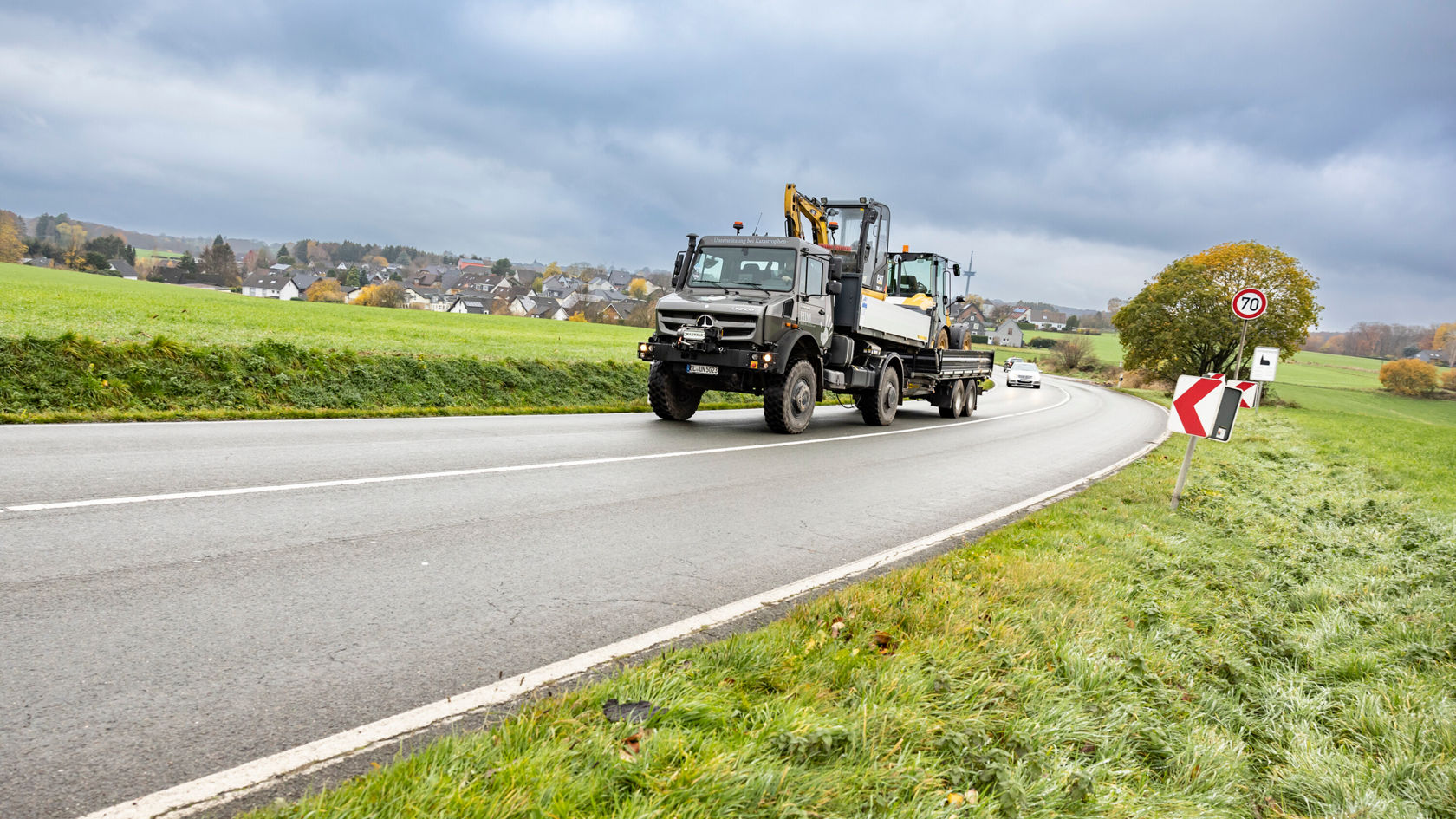 Loaded Unimog U 5023 on a country road.