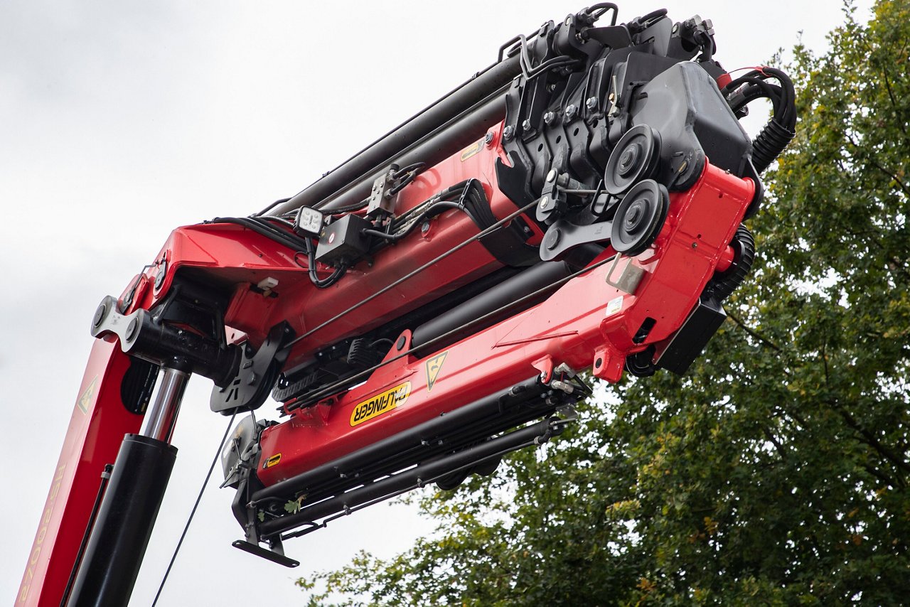 Close-up of a red crane machine.