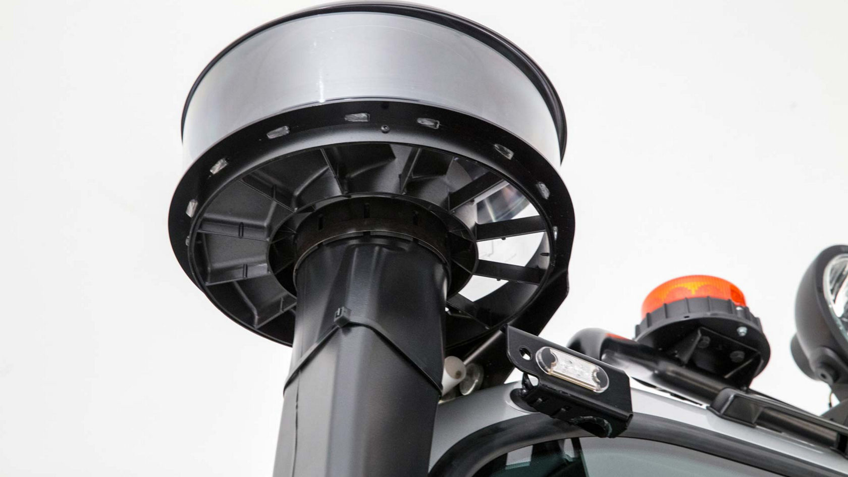 Close-up of the cyclone filter on the truck against a white background.