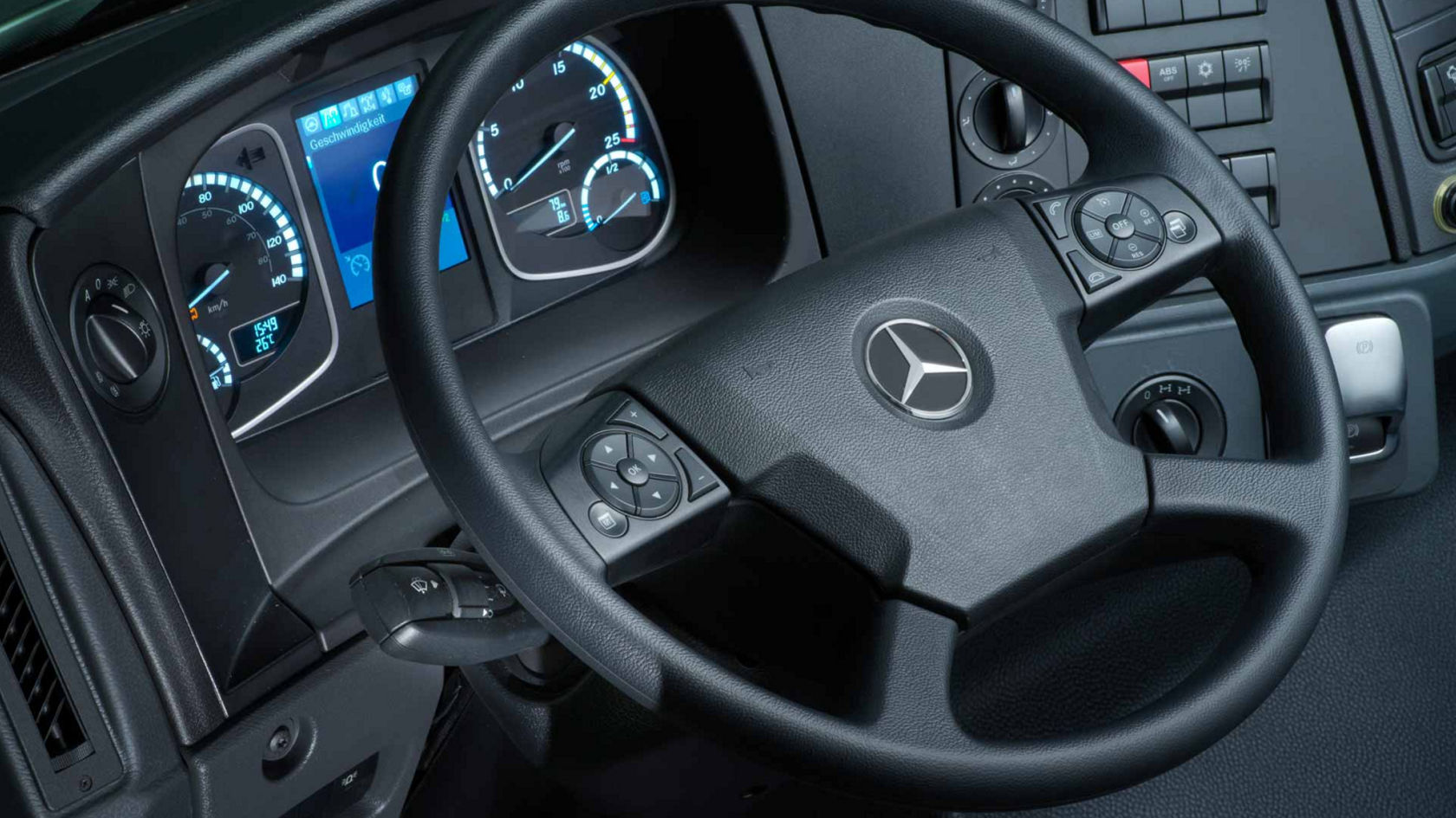 Close-up of the multifunction steering wheel with various controls for accessing the instrument cluster.