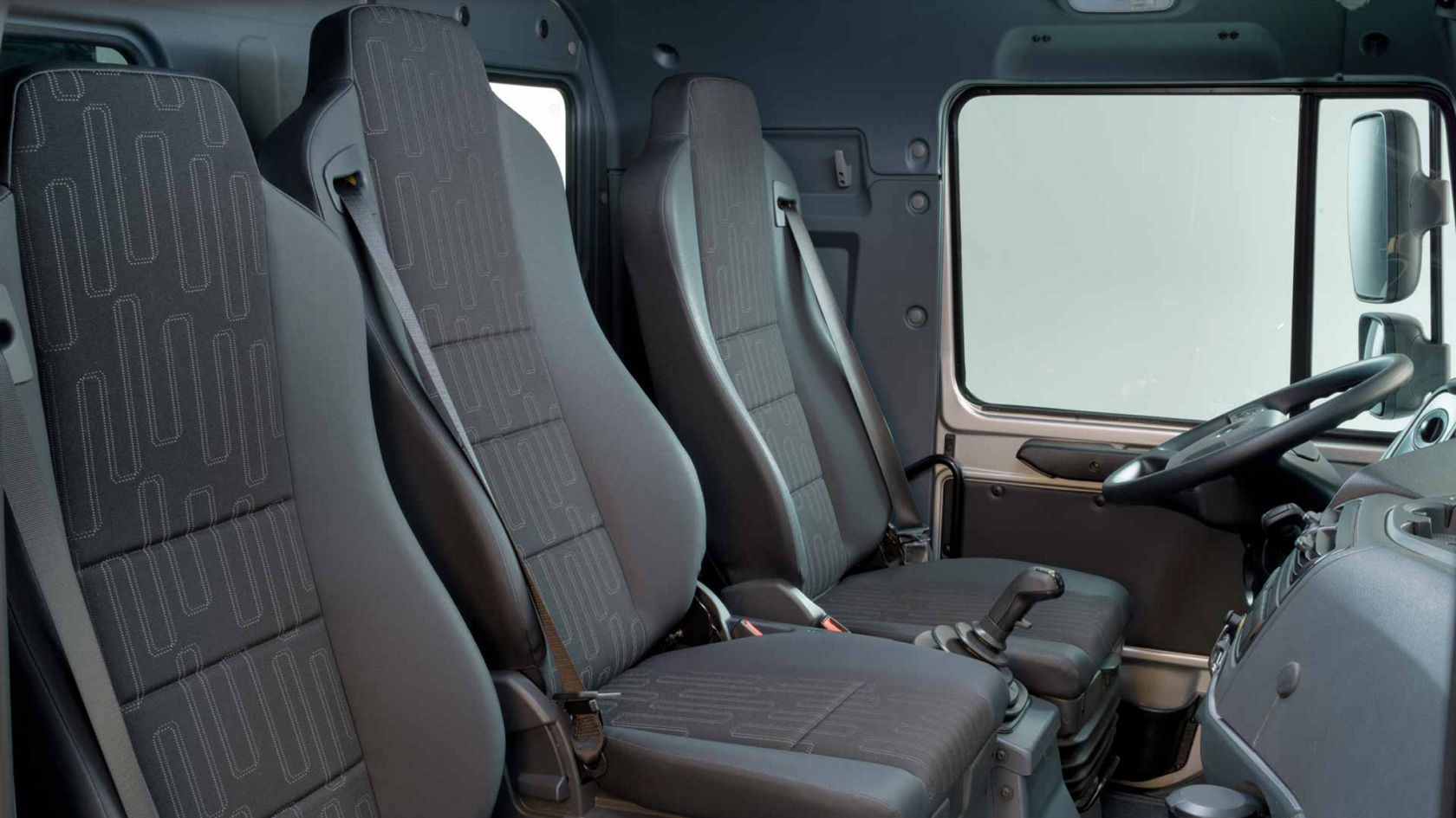 View of three individual seats from the front passenger door.